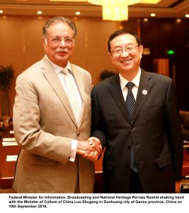 Federal Minister for Information, Broadcasting and National Heritage Pervaiz Rashid shaking hand with the Minister of Culture of China Luo Shugang in Dunhuang city of Gansu province, China on 19th September 2016.